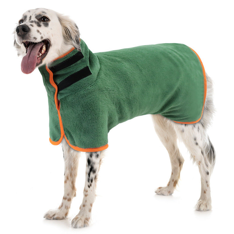 Dog in a green drying coat