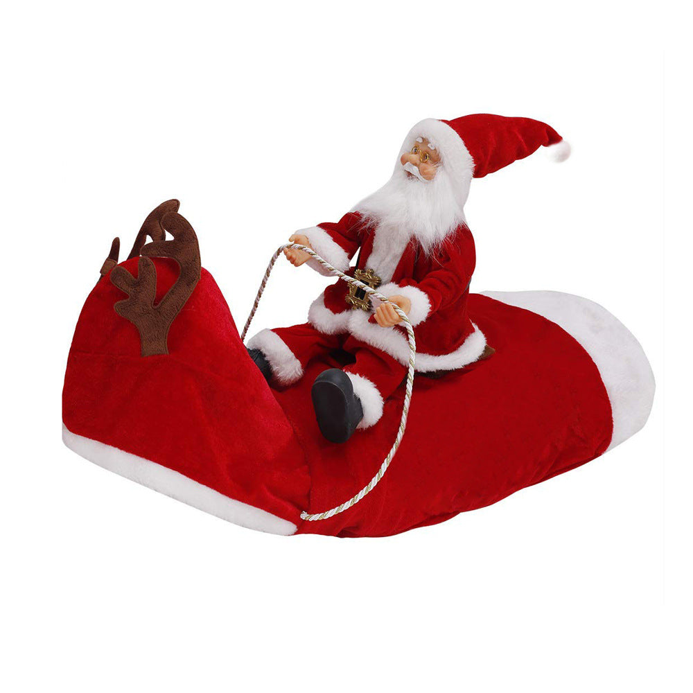 Bulldog wearing a red Santa rider costume with a toy Santa on its back