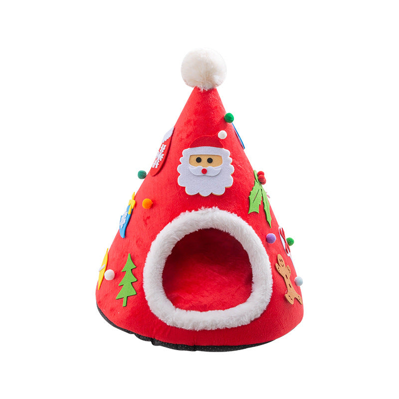Cat in a red Santa hat shaped cat bed next to a green tree version