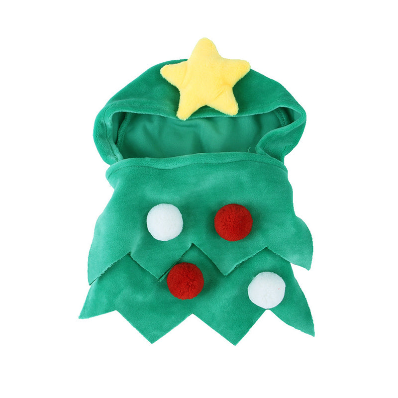 Cat wearing a green Christmas tree cape with pompoms and a star